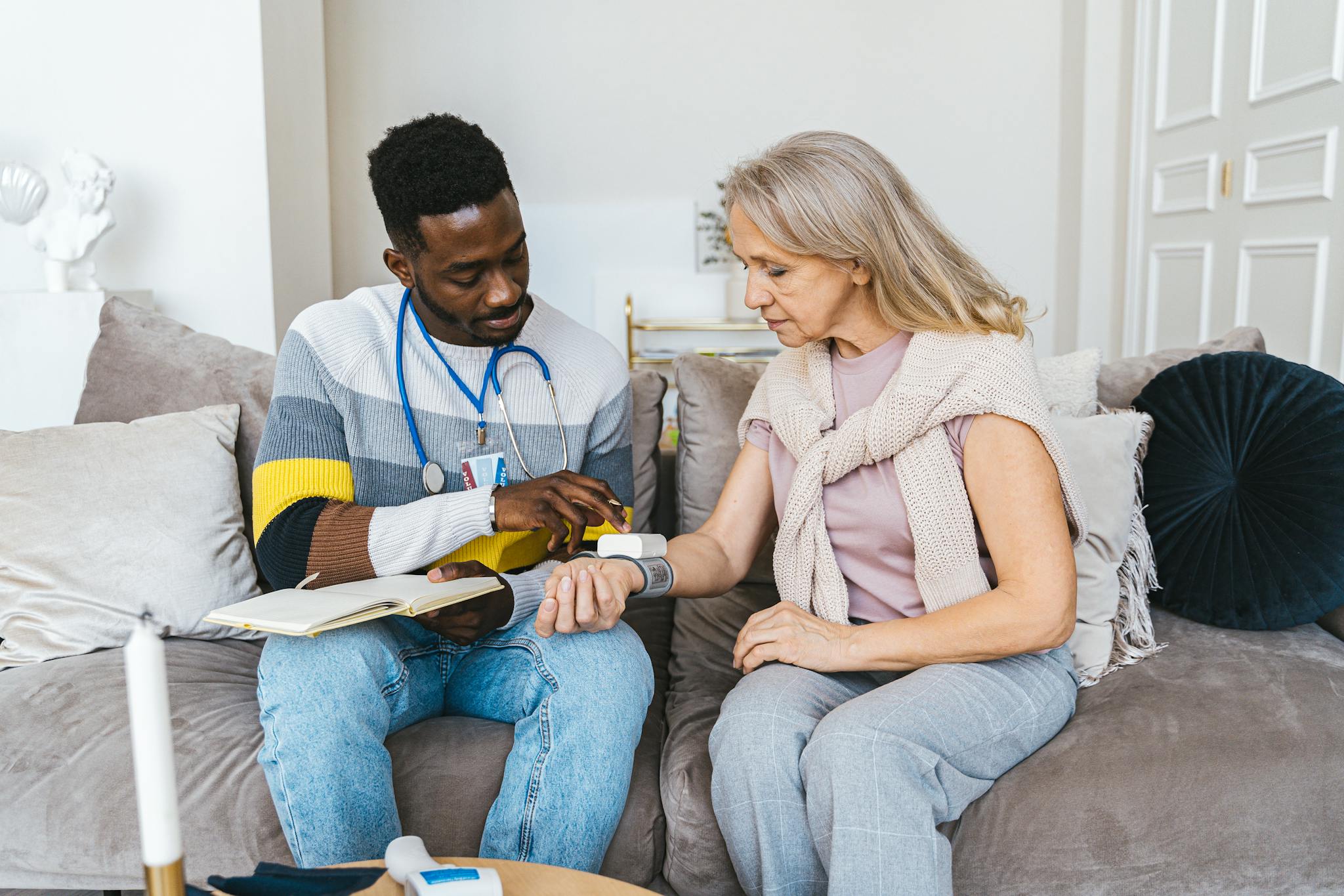 Healthcare professional checking blood pressure — Newport Home Health Medicaid Medicare Texas